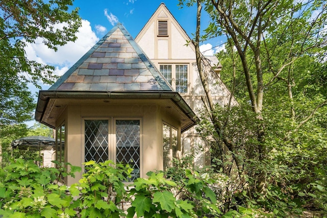 233 S Dawson Ave, Columbus, OH 43209 - view of home's exterior with stucco siding and a high end roof