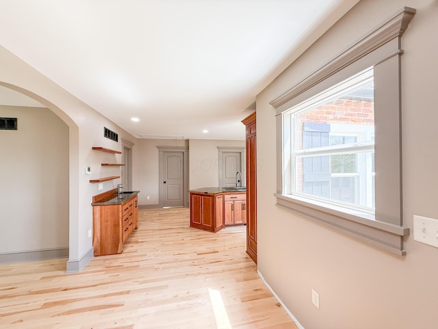 69 N Cherry St, Mount Gilead, OH 43338 - hall featuring arched walkways, light wood finished floors, and recessed lighting