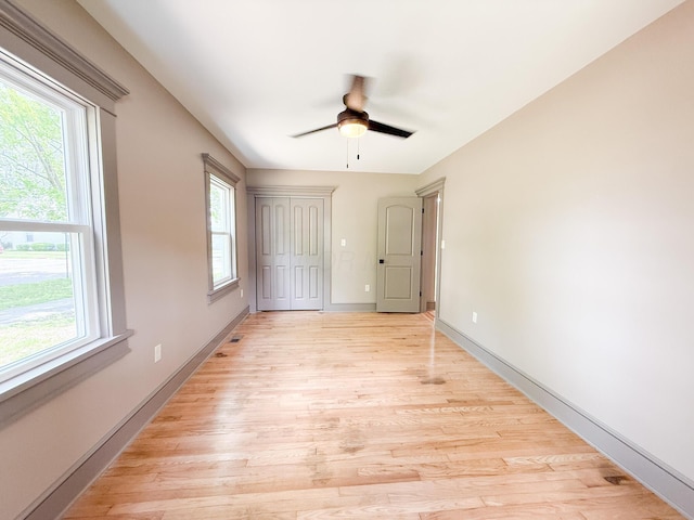 69 N Cherry St, Mount Gilead, OH 43338 - unfurnished bedroom featuring light wood-style floors, a closet, and a ceiling fan