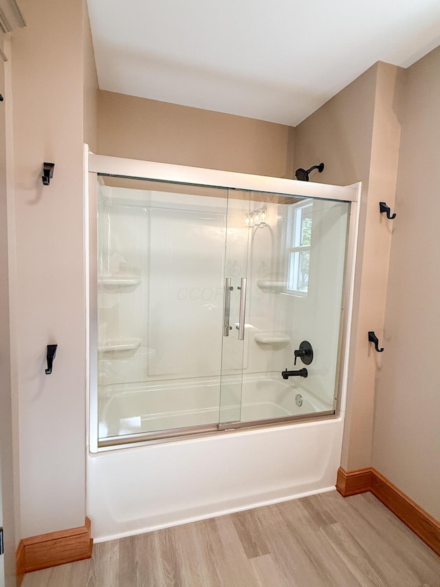 69 N Cherry St, Mount Gilead, OH 43338 - full bathroom with wood finished floors and bath / shower combo with glass door