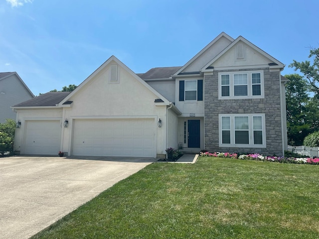 5124 Keefer Ln, Grove City, OH 43123 - view of front facade featuring stucco siding, stone siding, an attached garage, concrete driveway, and a front yard