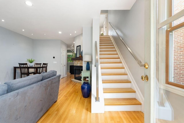979 Delaware Ave, Columbus, OH 43201 - staircase with wood finished floors, recessed lighting, and a fireplace