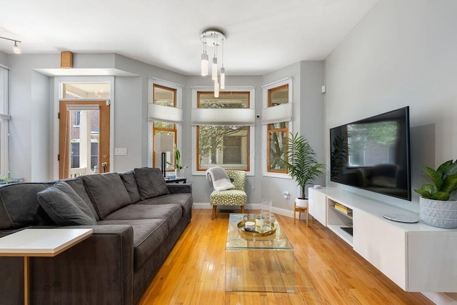 979 Delaware Ave, Columbus, OH 43201 - living room with light wood-type flooring and baseboards