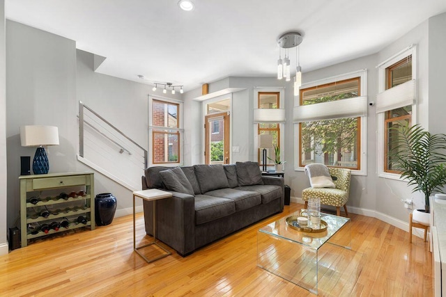 979 Delaware Ave, Columbus, OH 43201 - living area with hardwood / wood-style floors, plenty of natural light, and stairway
