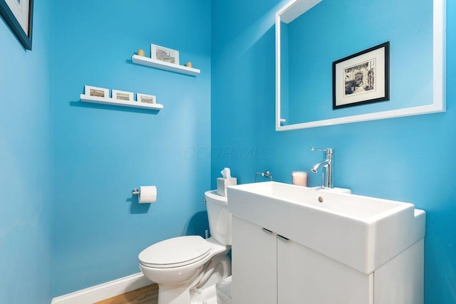 979 Delaware Ave, Columbus, OH 43201 - half bathroom with vanity and wood finished floors