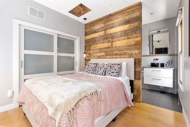979 Delaware Ave, Columbus, OH 43201 - bedroom featuring wood finished floors and wood walls