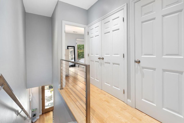 979 Delaware Ave, Columbus, OH 43201 - hallway with an upstairs landing and wood finished floors