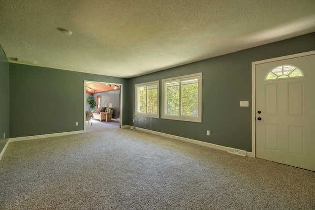 368 Mingo Rd, Chillicothe, OH 45601 - entryway with a textured ceiling and carpet flooring