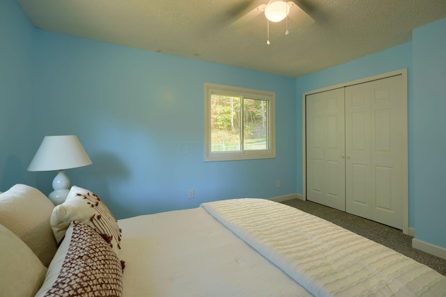 368 Mingo Rd, Chillicothe, OH 45601 - bedroom with a closet, a textured ceiling, carpet, and a ceiling fan