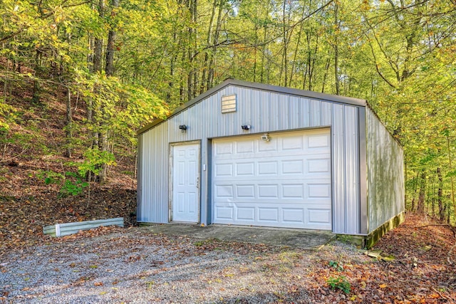368 Mingo Rd, Chillicothe, OH 45601 - detached garage with a forest view and driveway