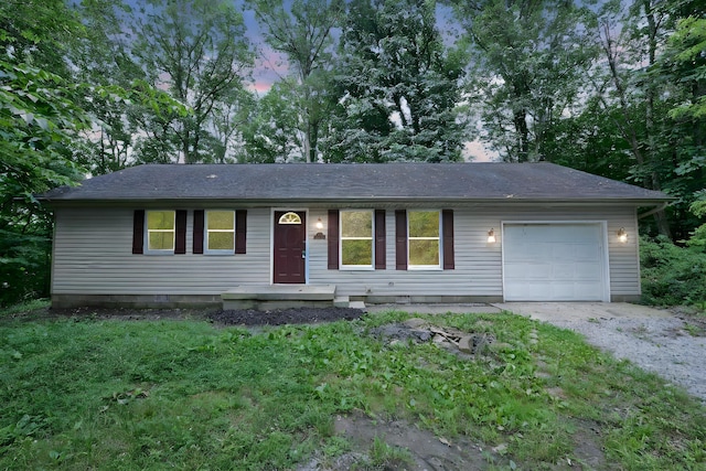 1142 Rozelle Creek Rd, Chillicothe, OH 45601 - single story home with gravel driveway, an attached garage, and a shingled roof