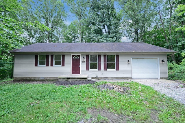 1142 Rozelle Creek Rd, Chillicothe, OH 45601 - ranch-style house with a garage and gravel driveway