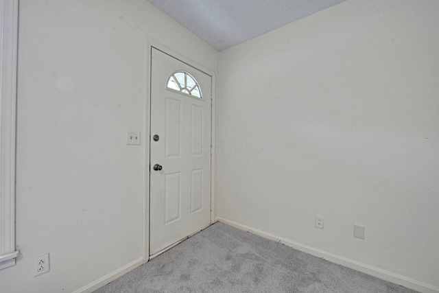 1142 Rozelle Creek Rd, Chillicothe, OH 45601 - entryway featuring light colored carpet and baseboards