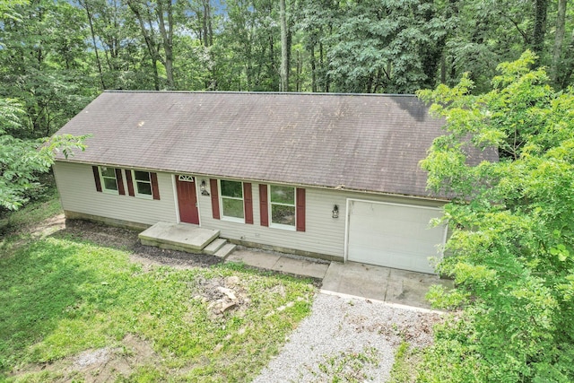 1142 Rozelle Creek Rd, Chillicothe, OH 45601 - view of front of house featuring dirt driveway, a garage, and roof with shingles