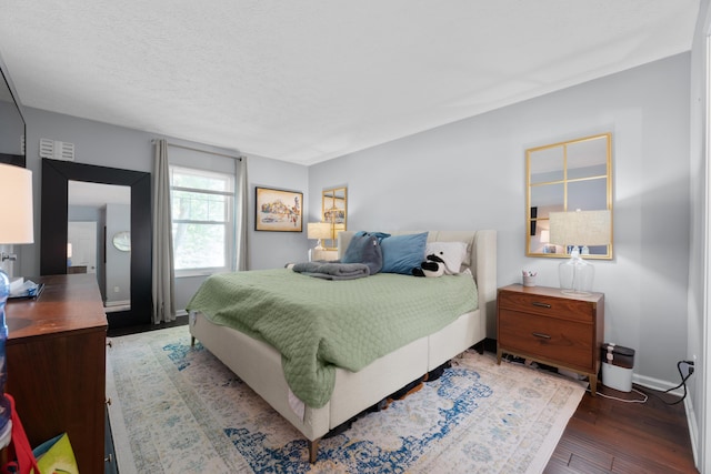 3823 Ramblehurst Rd, Columbus, OH 43221 - bedroom featuring wood finished floors and a textured ceiling