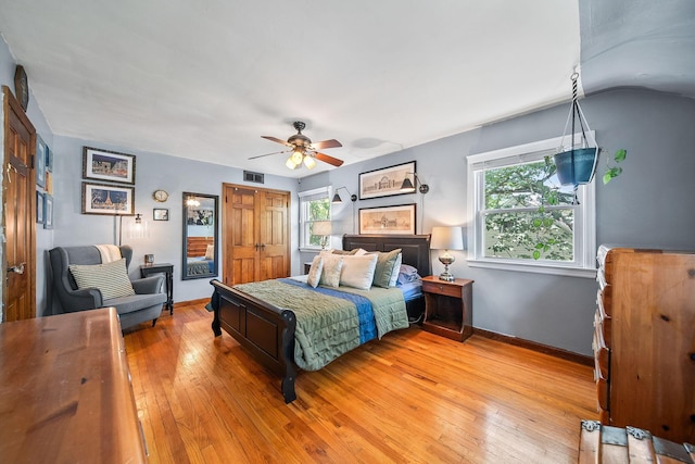 1467 Melrose Ave, Columbus, OH 43224 - bedroom featuring multiple windows, light wood-type flooring, and ceiling fan