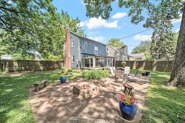 1467 Melrose Ave, Columbus, OH 43224 - fenced backyard with a sunroom, a fire pit, and a patio area
