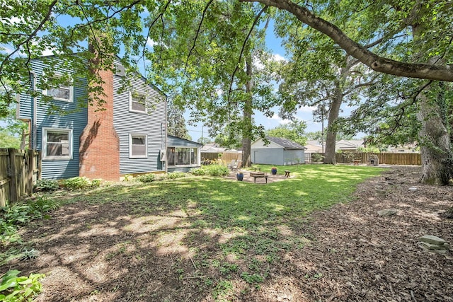 1467 Melrose Ave, Columbus, OH 43224 - fenced backyard featuring a sunroom