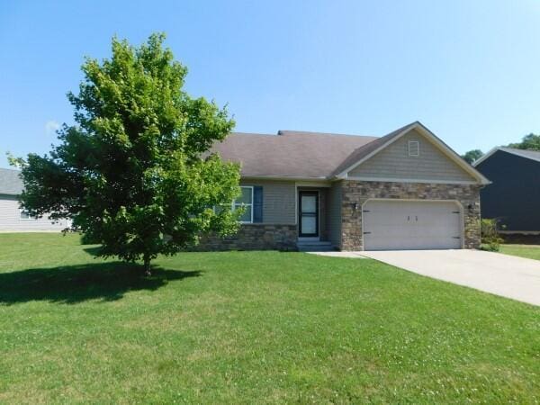 32340 Lilac Ln, Logan, OH 43138 - view of front facade featuring a garage, stone siding, a front yard, and concrete driveway