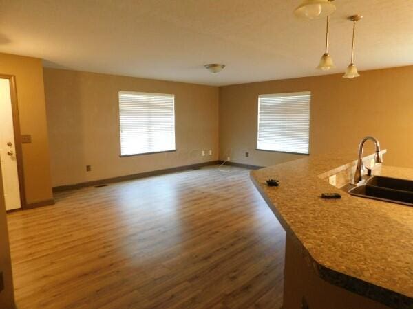 32340 Lilac Ln, Logan, OH 43138 - kitchen with wood finished floors and pendant lighting