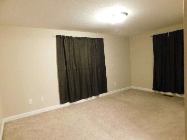 32340 Lilac Ln, Logan, OH 43138 - unfurnished room with light carpet and baseboards