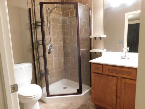 32340 Lilac Ln, Logan, OH 43138 - full bath with vanity, a stall shower, and tile patterned floors
