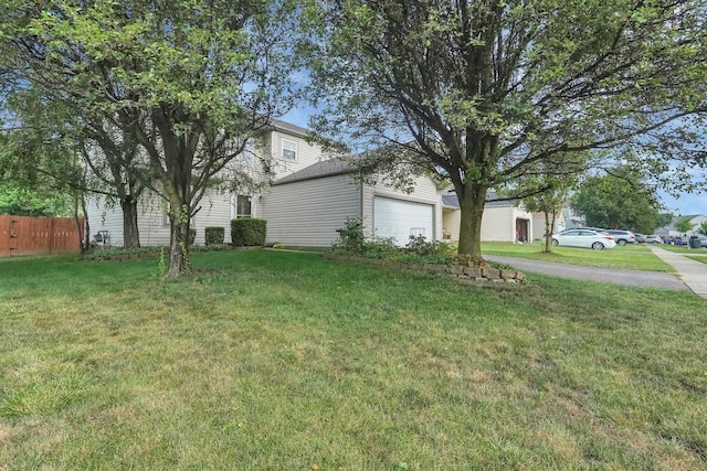 5683 Levi Kramer Blvd, Canal Winchester, OH 43110 - view of yard featuring an attached garage and asphalt driveway