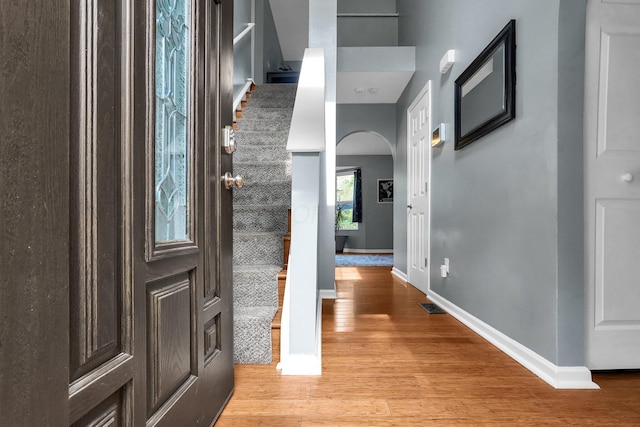 5683 Levi Kramer Blvd, Canal Winchester, OH 43110 - foyer entrance featuring arched walkways, light wood-style flooring, and stairs