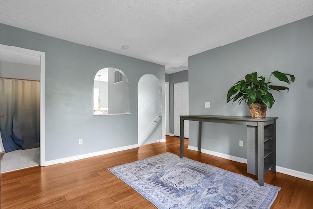 5683 Levi Kramer Blvd, Canal Winchester, OH 43110 - interior space with wood finished floors, arched walkways, and a textured ceiling