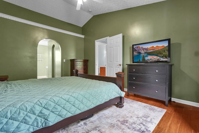 5683 Levi Kramer Blvd, Canal Winchester, OH 43110 - bedroom with arched walkways, vaulted ceiling, wood finished floors, and ceiling fan