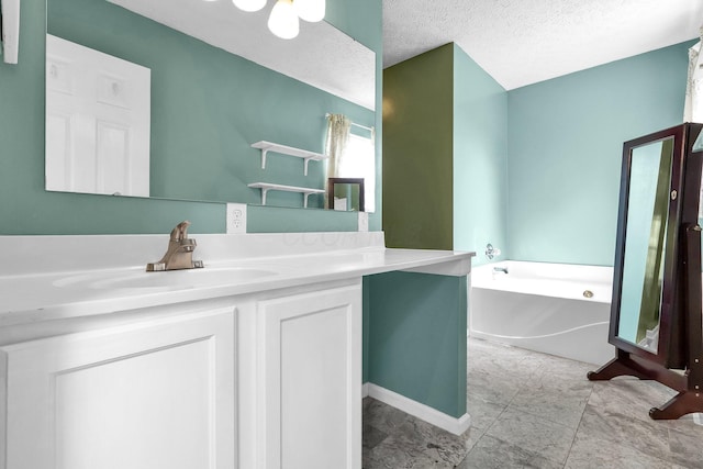 5683 Levi Kramer Blvd, Canal Winchester, OH 43110 - full bathroom featuring a garden tub, vanity, and a textured ceiling