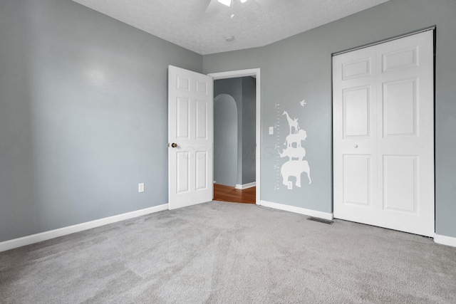 5683 Levi Kramer Blvd, Canal Winchester, OH 43110 - unfurnished bedroom featuring carpet flooring, a textured ceiling, and ceiling fan