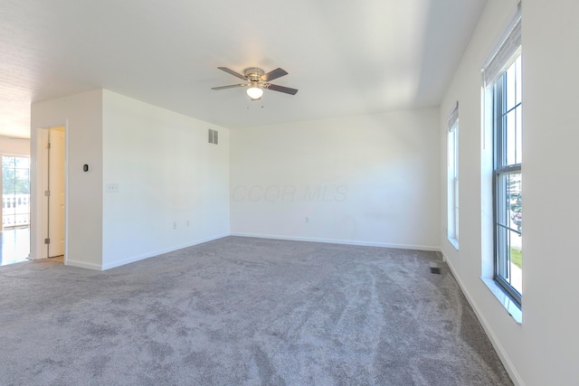 7145 Billy Goat Dr, New Albany, OH 43054 - empty room with plenty of natural light, carpet floors, and ceiling fan