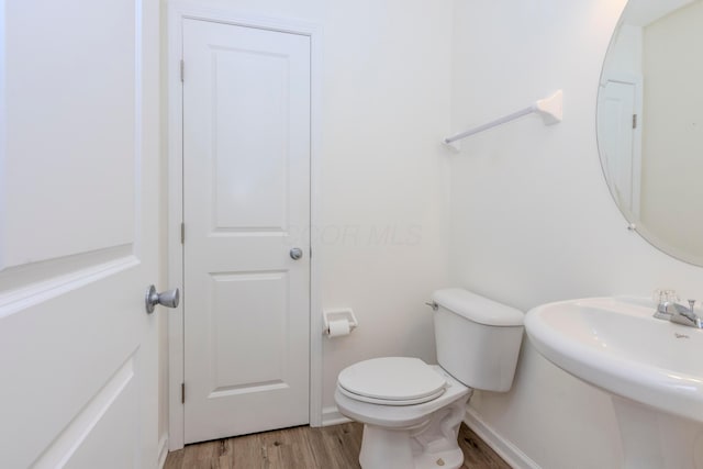 7145 Billy Goat Dr, New Albany, OH 43054 - half bath with wood finished floors and toilet
