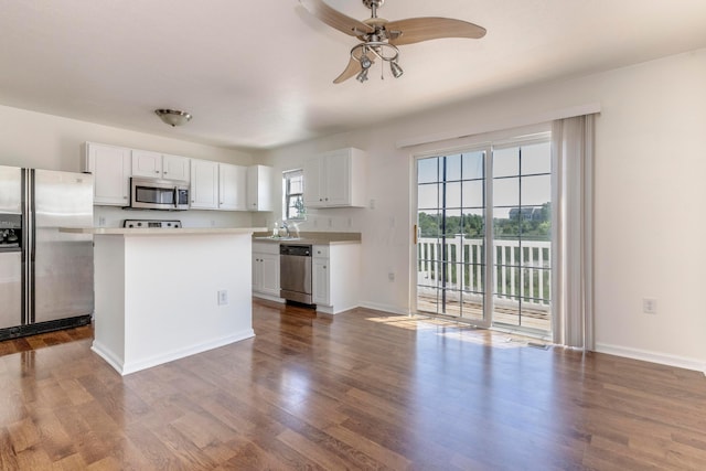 7145 Billy Goat Dr, New Albany, OH 43054 - kitchen with stainless steel appliances, a ceiling fan, white cabinetry, and light countertops