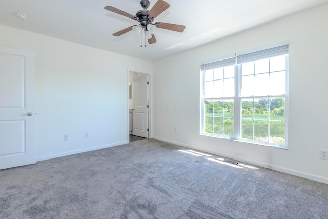 7145 Billy Goat Dr, New Albany, OH 43054 - spare room featuring carpet floors, ceiling fan, and a smoke detector
