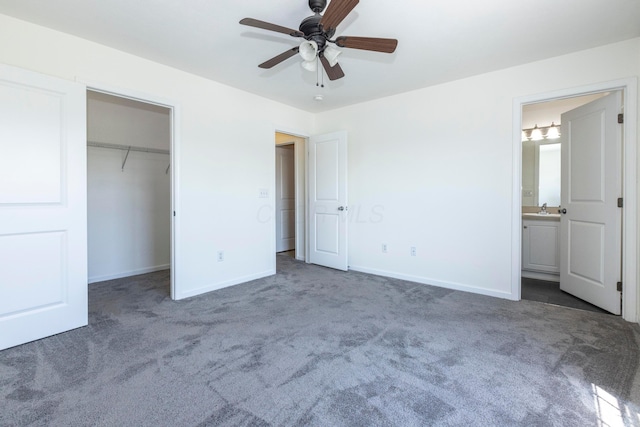 7145 Billy Goat Dr, New Albany, OH 43054 - unfurnished bedroom with carpet, connected bathroom, a closet, a spacious closet, and ceiling fan
