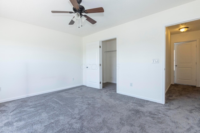 7145 Billy Goat Dr, New Albany, OH 43054 - unfurnished bedroom with carpet, a walk in closet, and a ceiling fan
