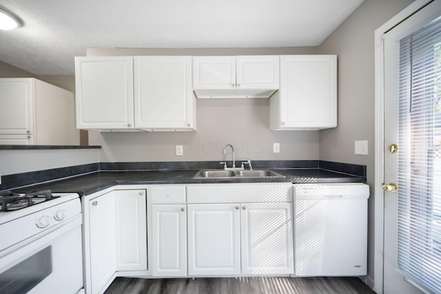 2272 Eden Ave, Columbus, OH 43224 - kitchen with white appliances, white cabinetry, dark countertops, and dark wood-style flooring