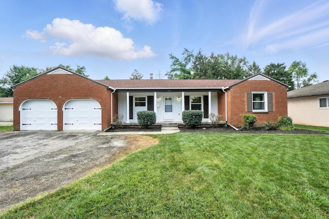 899 Meadowview Dr, Columbus, OH 43224 - single story home with brick siding, asphalt driveway, an attached garage, and a front yard