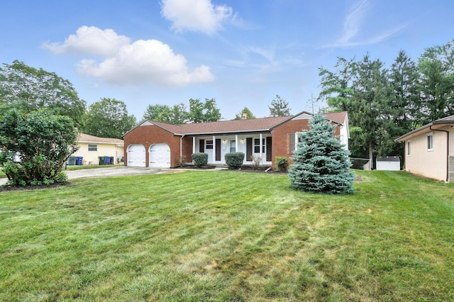 899 Meadowview Dr, Columbus, OH 43224 - single story home with a garage, concrete driveway, a front yard, and brick siding