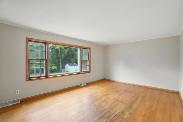 899 Meadowview Dr, Columbus, OH 43224 - spare room featuring light wood-style floors and crown molding