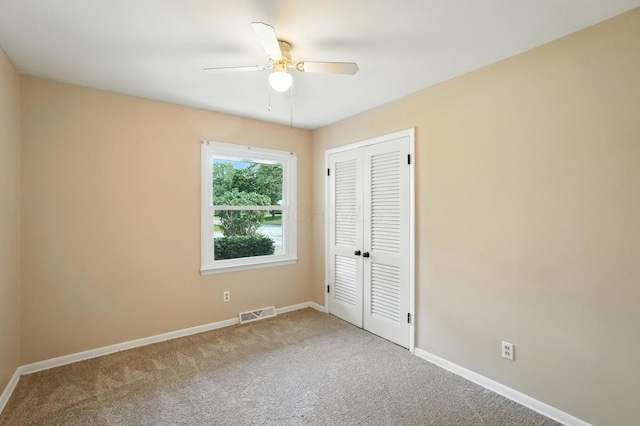 899 Meadowview Dr, Columbus, OH 43224 - unfurnished bedroom with carpet floors, a closet, and a ceiling fan