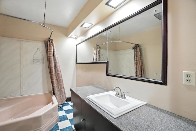 899 Meadowview Dr, Columbus, OH 43224 - full bathroom with vanity, shower / tub combo with curtain, and tile patterned floors