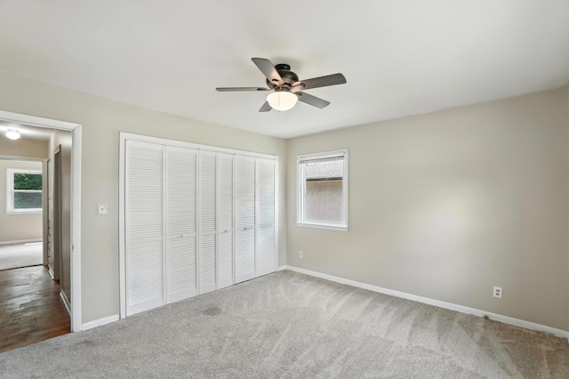 899 Meadowview Dr, Columbus, OH 43224 - unfurnished bedroom with carpet, a closet, a ceiling fan, and attic access