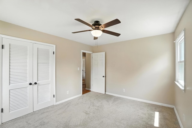 899 Meadowview Dr, Columbus, OH 43224 - unfurnished bedroom with carpet, a closet, and a ceiling fan