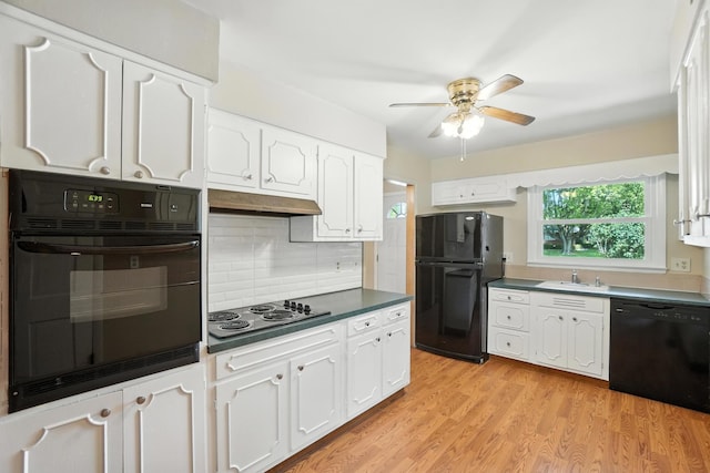 899 Meadowview Dr, Columbus, OH 43224 - kitchen with black appliances, white cabinetry, a ceiling fan, and dark countertops