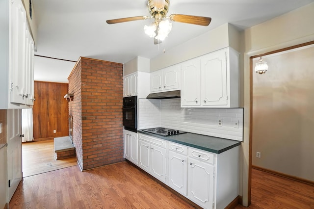 899 Meadowview Dr, Columbus, OH 43224 - kitchen featuring black appliances, dark countertops, white cabinets, a ceiling fan, and backsplash