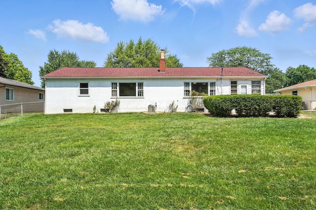 899 Meadowview Dr, Columbus, OH 43224 - rear view of house featuring stucco siding and a chimney
