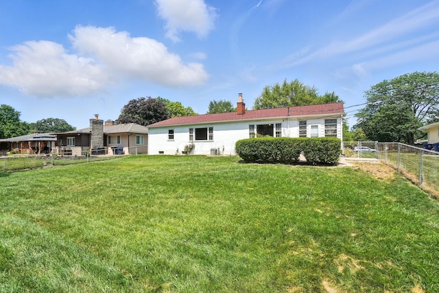 899 Meadowview Dr, Columbus, OH 43224 - rear view of property with a fenced backyard and a chimney